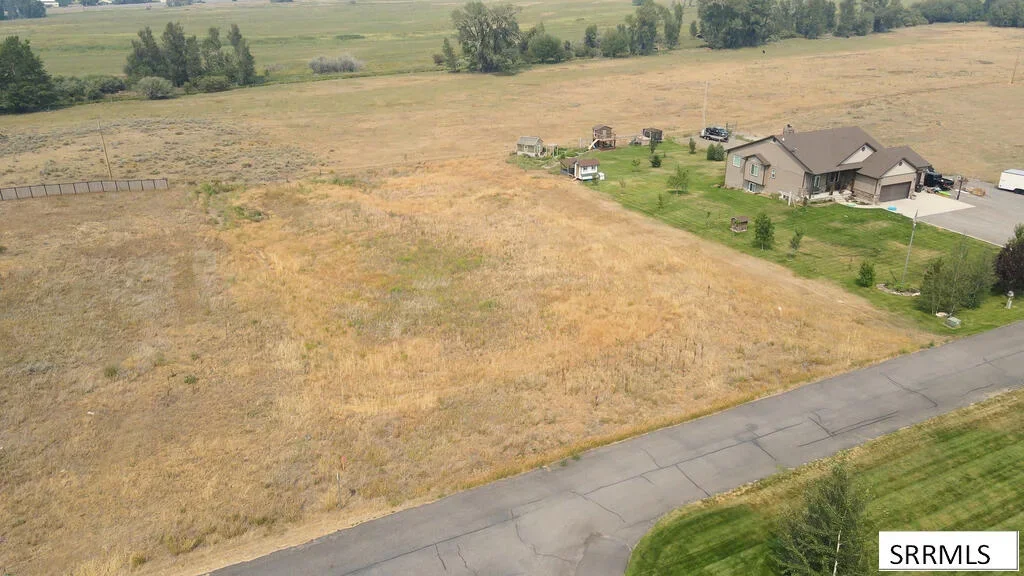 A home on open acreage above a paved country road in East Idaho