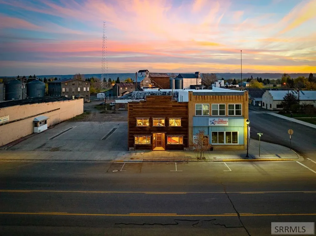 Historic brick storefronts on Main Street in Ashton, Idaho, at sunset